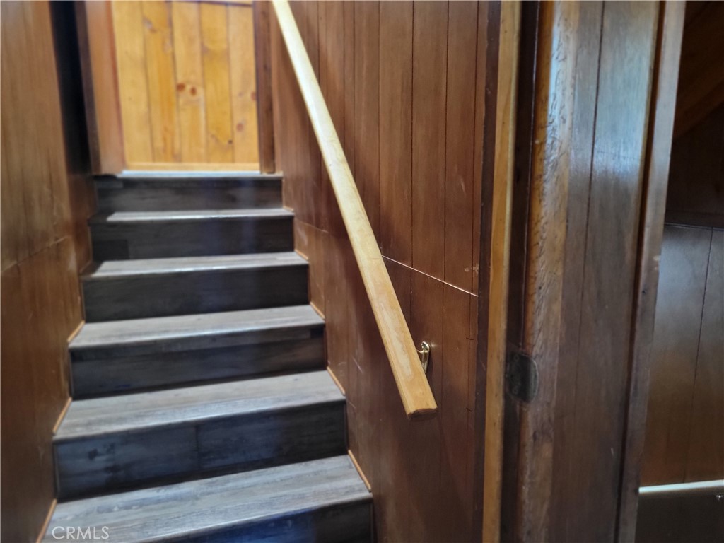 1116 Lark Road Wrightwood, CA 92397 - Photo 42 of 46 a view of staircase with wooden floor and white walls