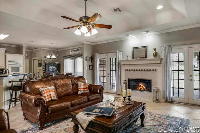 a living room with furniture and a fireplace