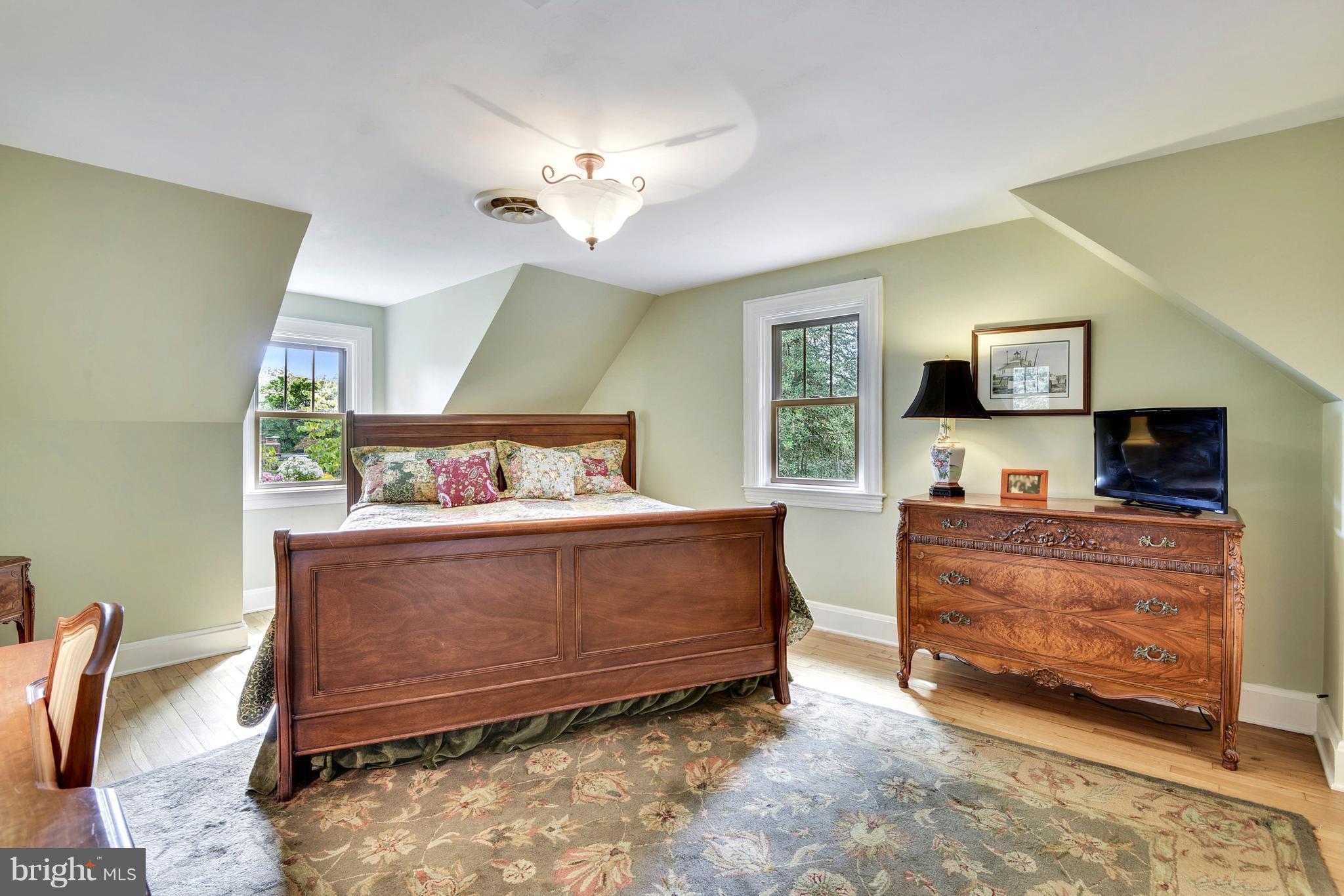 720 Red Cedar Road Annapolis, MD 21409 - Photo 14 of 30 a bed room with furniture and a flat screen tv