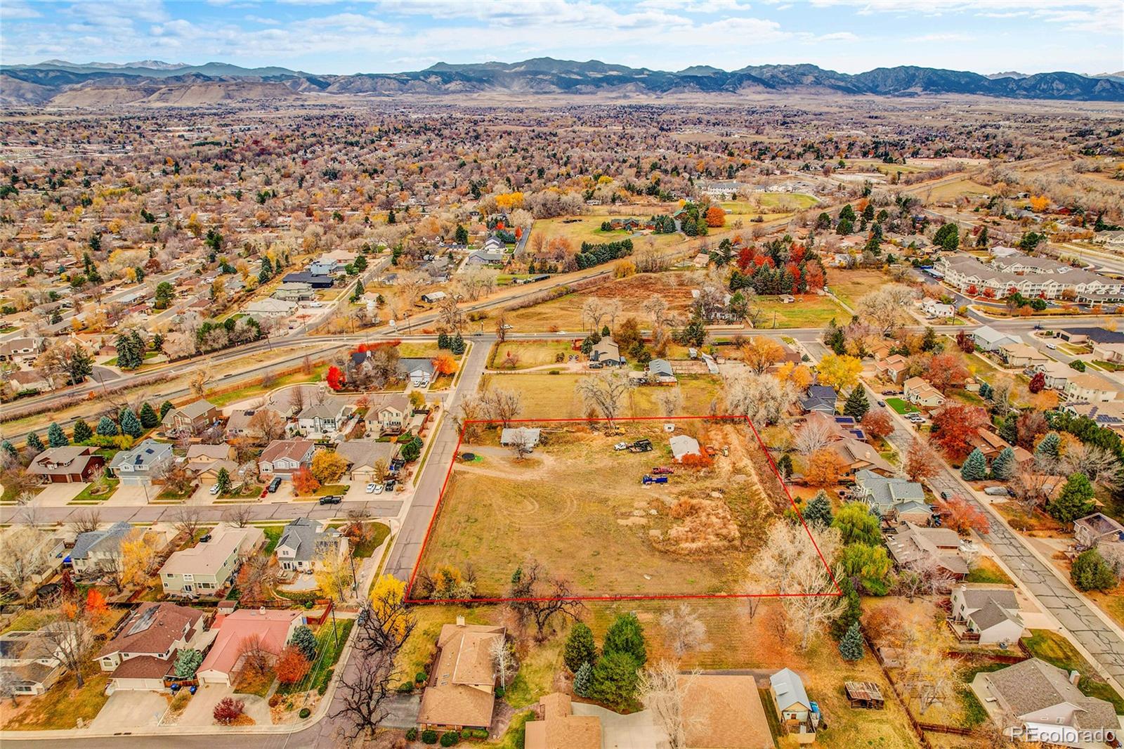 9909 West 70th Avenue Arvada, CO 80004 - Photo 14 of 23 an aerial view of residential building and trees