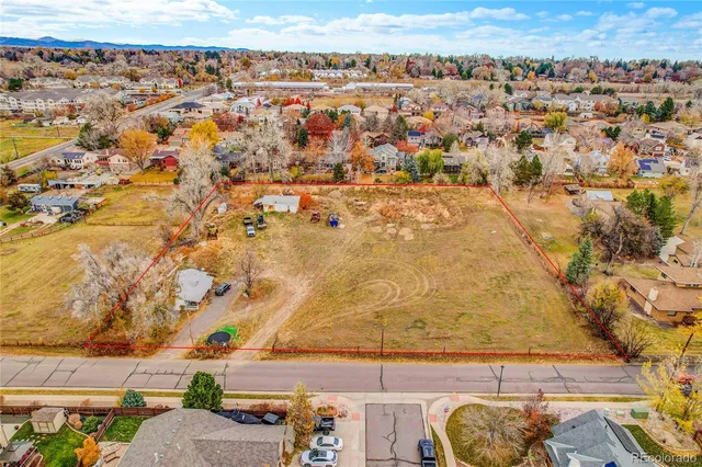 an aerial view of residential building and parking space