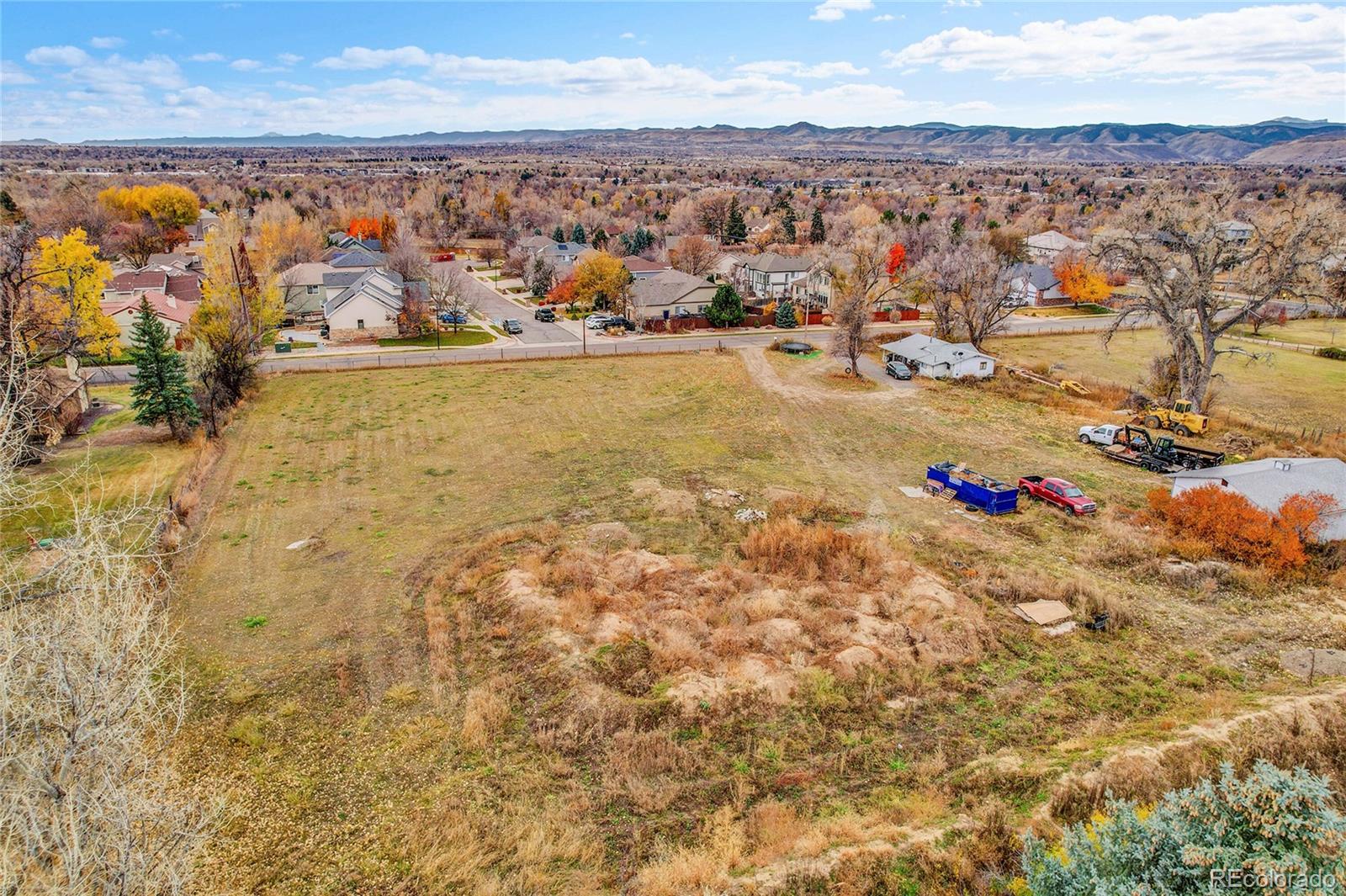 9909 West 70th Avenue Arvada, CO 80004 - Photo 23 of 23 an aerial view of residential houses with outdoor space