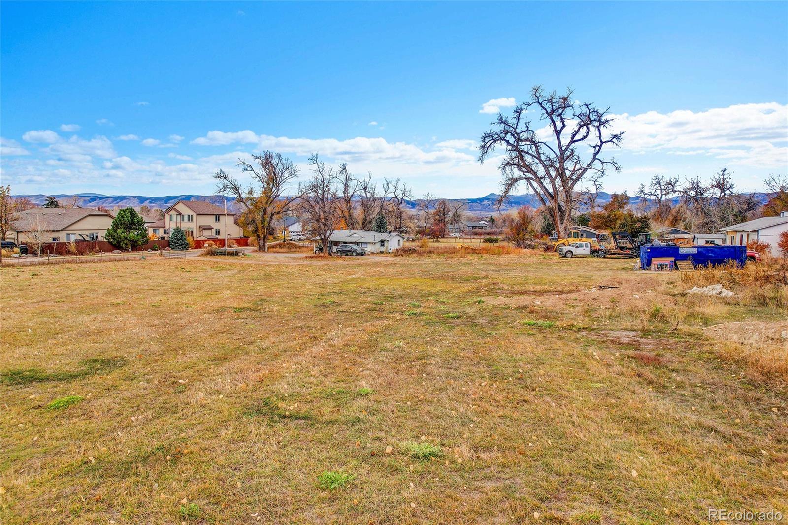 9909 West 70th Avenue Arvada, CO 80004 - Photo 7 of 23 a view of a street with a building in the background