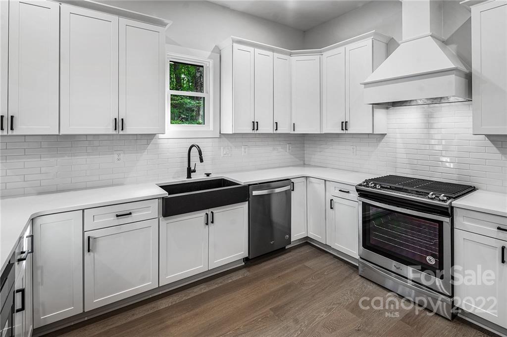 16025 Kiki Court Tega Cay, SC 29708 - Photo 1 of 39 a kitchen with cabinets appliances a sink and a window