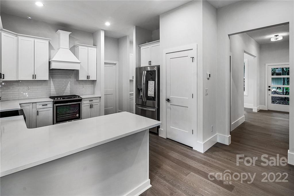 16025 Kiki Court Tega Cay, SC 29708 - Photo 13 of 39 a kitchen with stainless steel appliances a refrigerator sink and cabinets