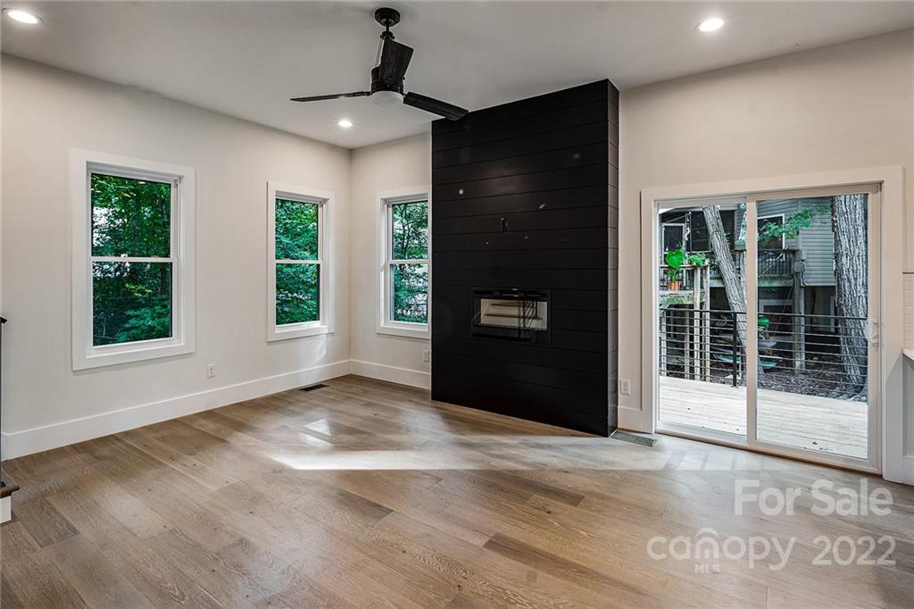 16025 Kiki Court Tega Cay, SC 29708 - Photo 18 of 39 a view of an empty room with a window and balcony