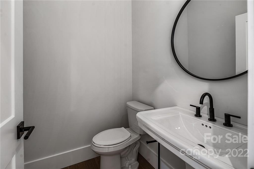 16025 Kiki Court Tega Cay, SC 29708 - Photo 21 of 39 a bathroom with a sink and a mirror