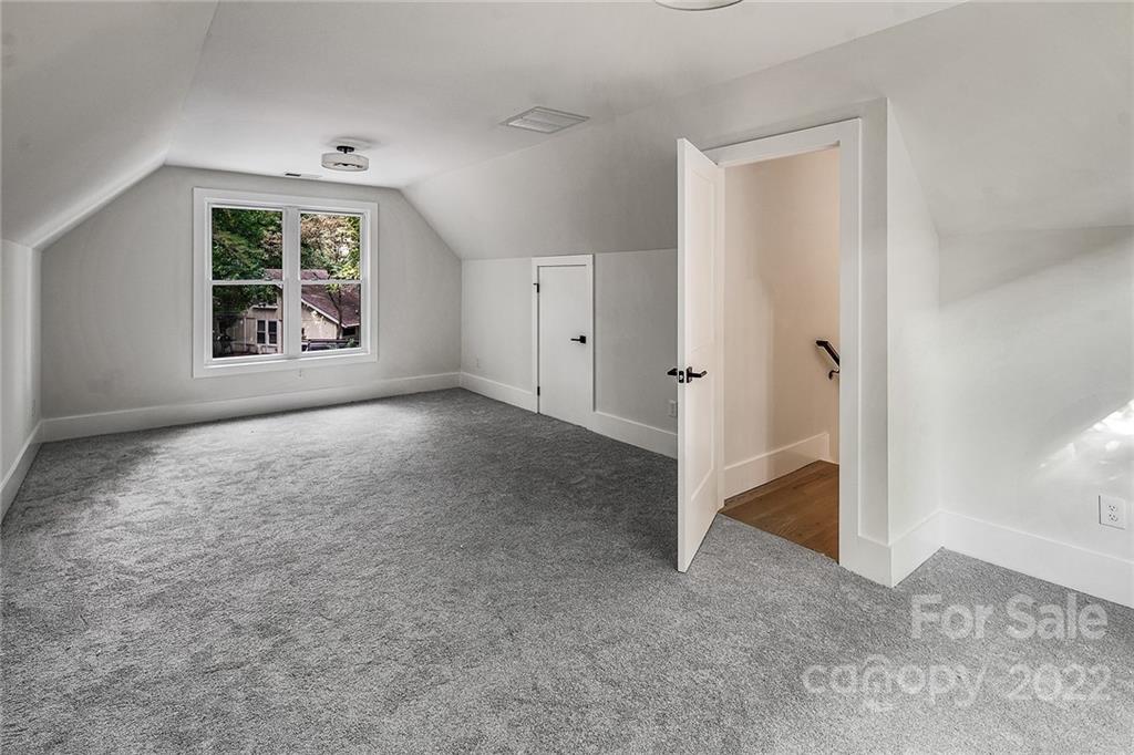 16025 Kiki Court Tega Cay, SC 29708 - Photo 25 of 39 an empty room with windows and closet