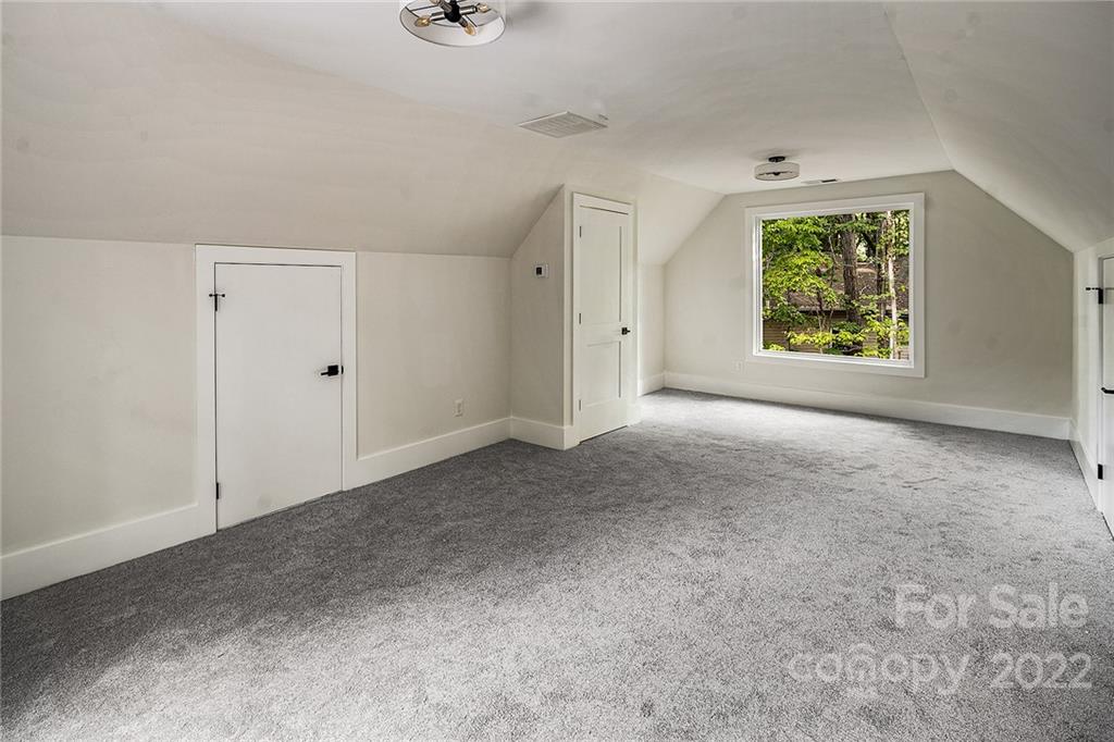 16025 Kiki Court Tega Cay, SC 29708 - Photo 26 of 39 a view of an empty room with windows