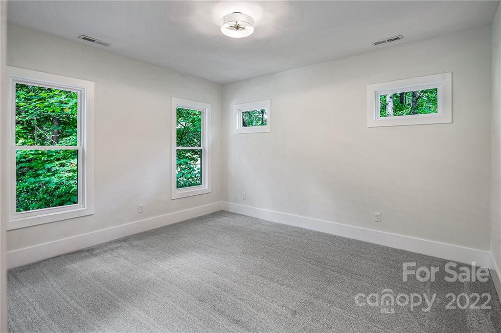 16025 Kiki Court Tega Cay, SC 29708 - Photo 34 of 39 a view of an empty room with a window
