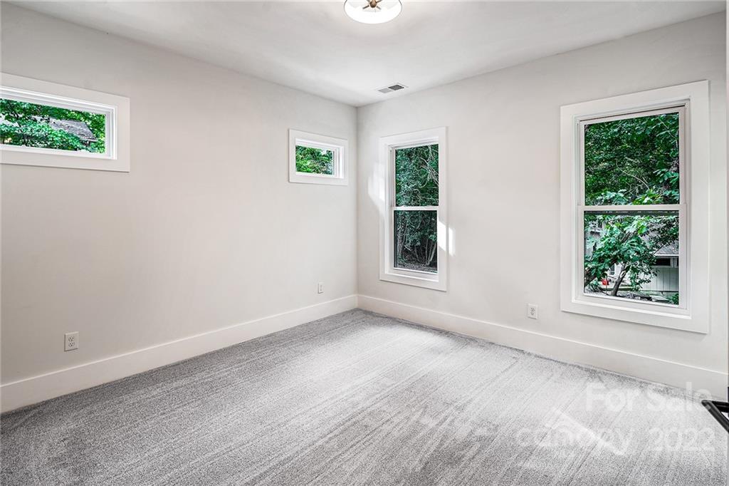 16025 Kiki Court Tega Cay, SC 29708 - Photo 36 of 39 an empty room with windows