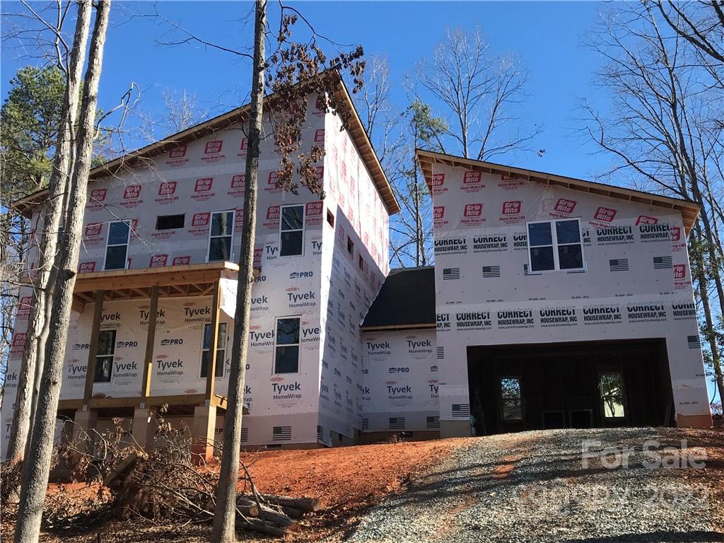 16025 Kiki Court Tega Cay, SC 29708 - Photo 39 of 39 a large building with a small yard
