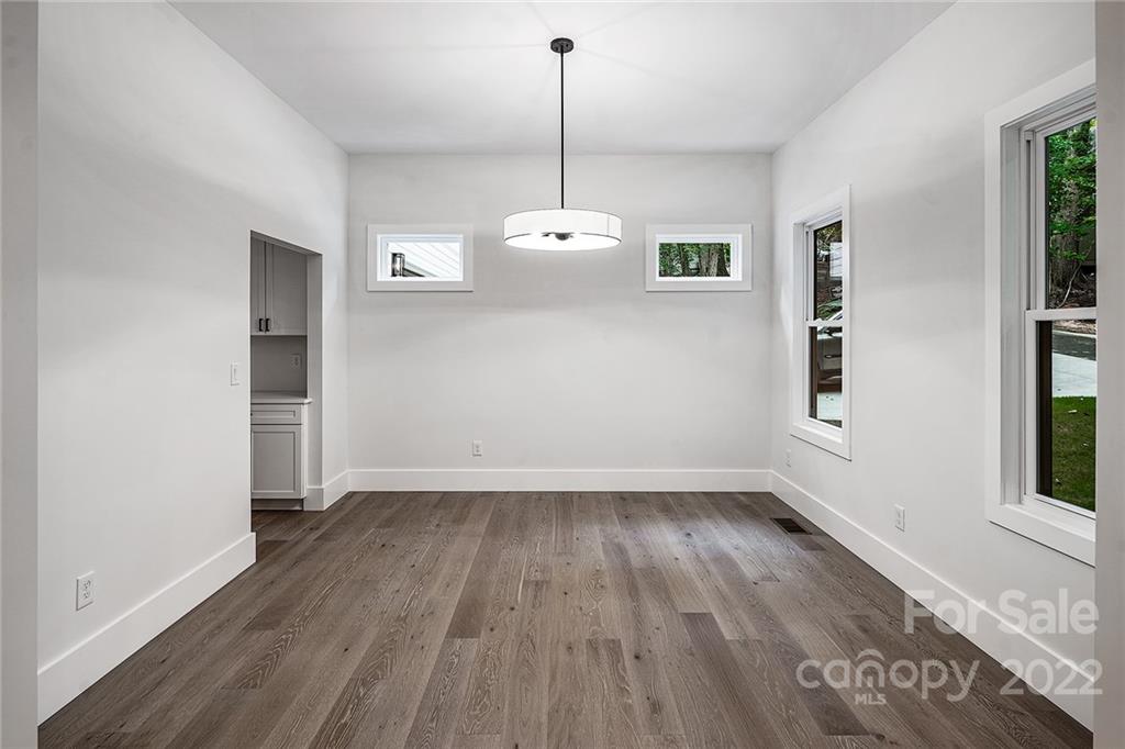 16025 Kiki Court Tega Cay, SC 29708 - Photo 6 of 39 a view of a room with wooden floor and entryway