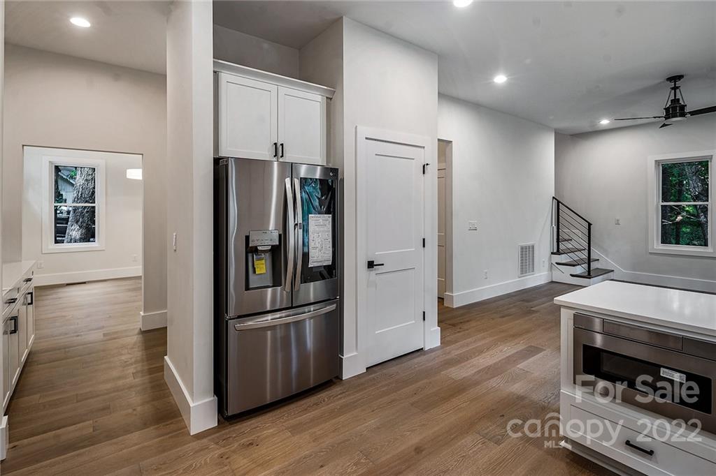 16025 Kiki Court Tega Cay, SC 29708 - Photo 10 of 39 a kitchen with stainless steel appliances a refrigerator and a stove top oven