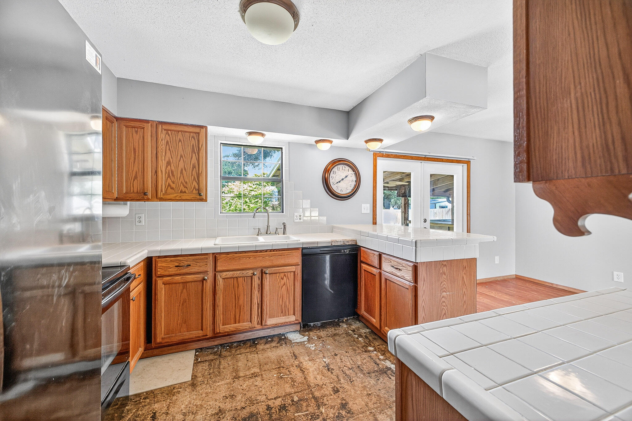 121 Boyce Road Shalimar, FL 32579 - Photo 12 of 34 a kitchen with stainless steel appliances granite countertop a sink and a stove top oven