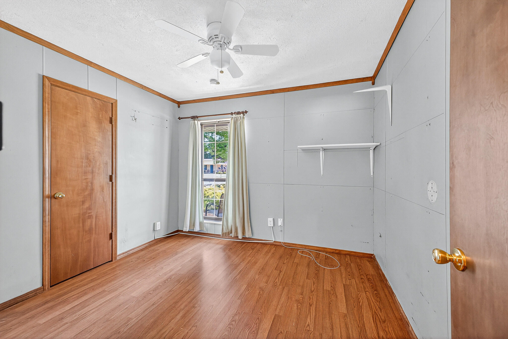 121 Boyce Road Shalimar, FL 32579 - Photo 15 of 34 an empty room with wooden floor closet and windows