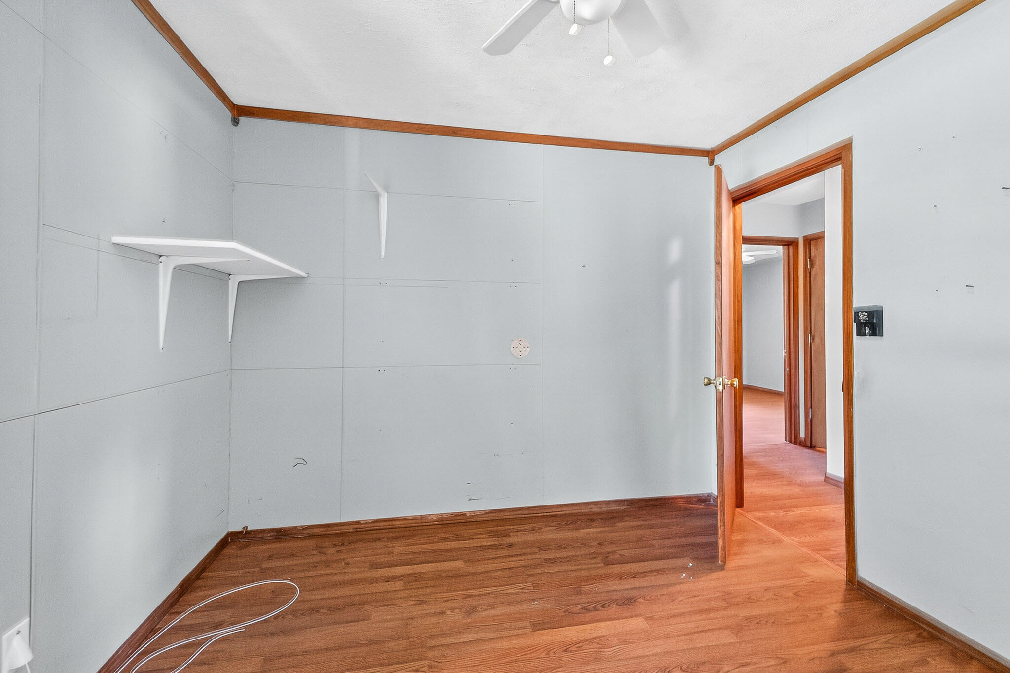 121 Boyce Road Shalimar, FL 32579 - Photo 16 of 34 a view of an empty room with wooden floor and a window
