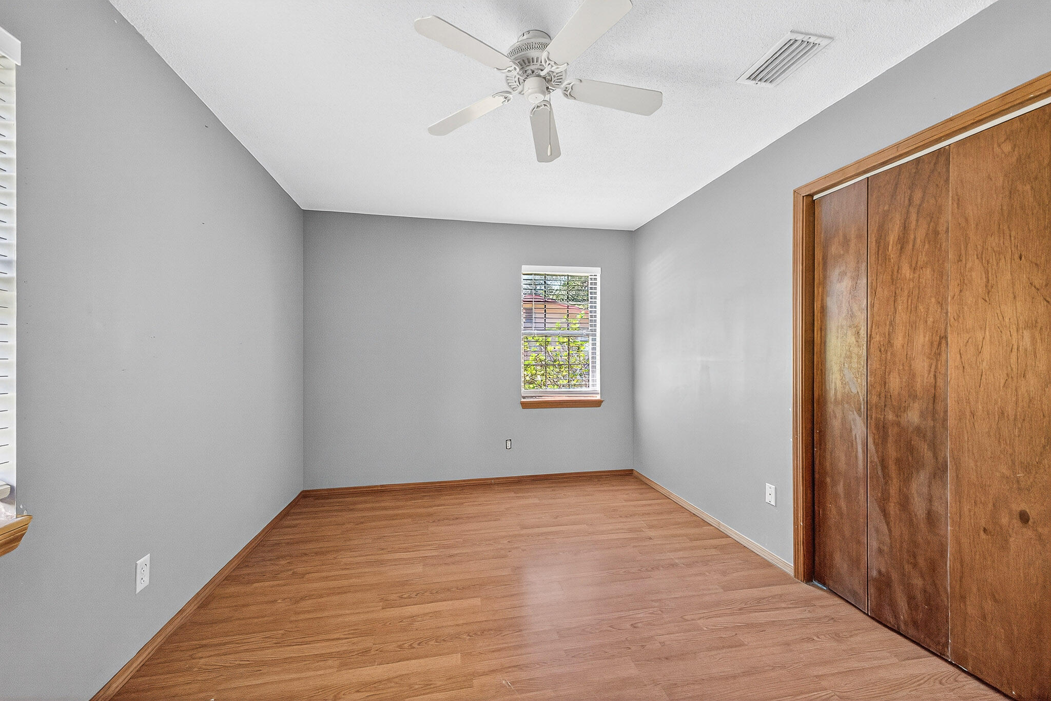 121 Boyce Road Shalimar, FL 32579 - Photo 18 of 34 an empty room with windows and fan