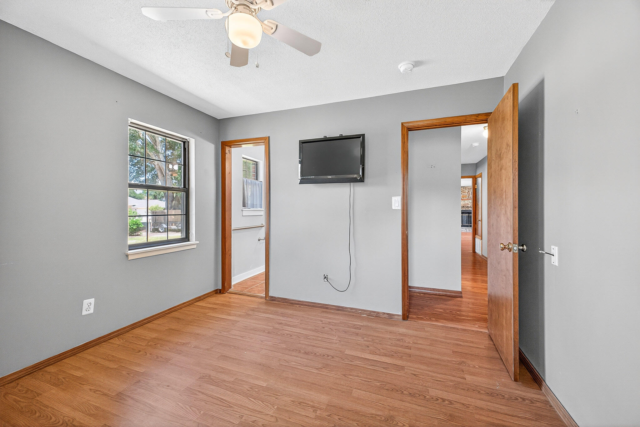 121 Boyce Road Shalimar, FL 32579 - Photo 21 of 34 a view of an empty room with window and wooden floor