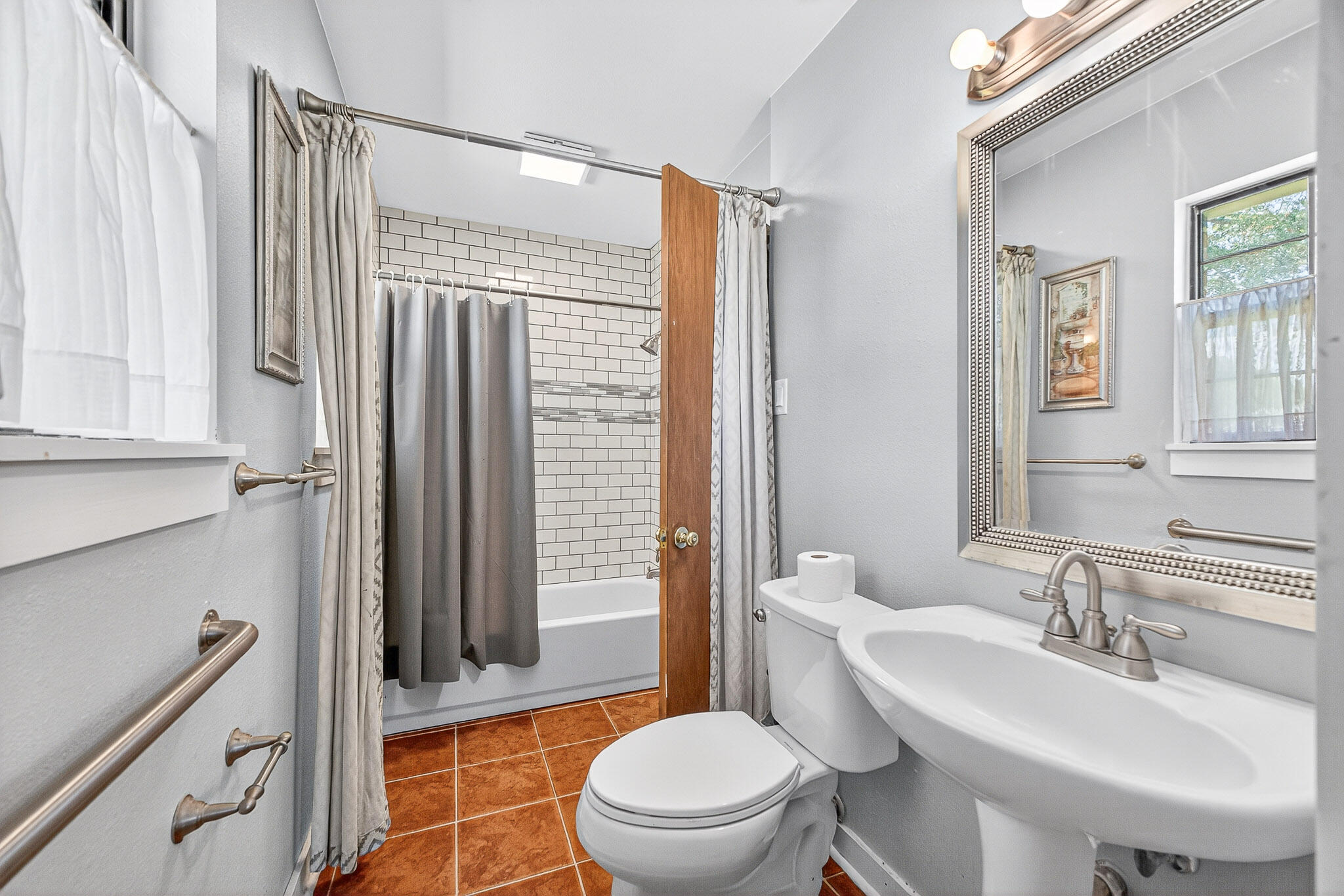 121 Boyce Road Shalimar, FL 32579 - Photo 23 of 34 a bathroom with a sink toilet and shower