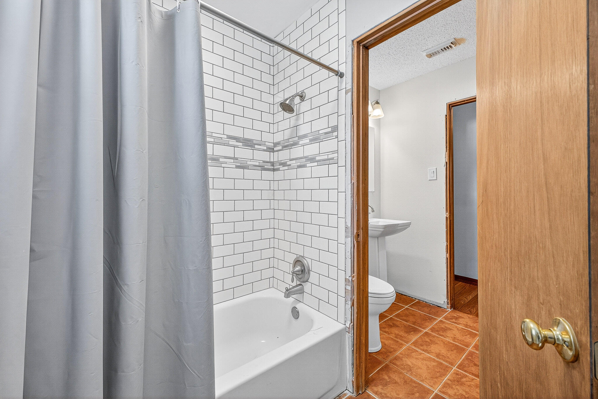 121 Boyce Road Shalimar, FL 32579 - Photo 24 of 34 a bathroom with a bathtub and a shower