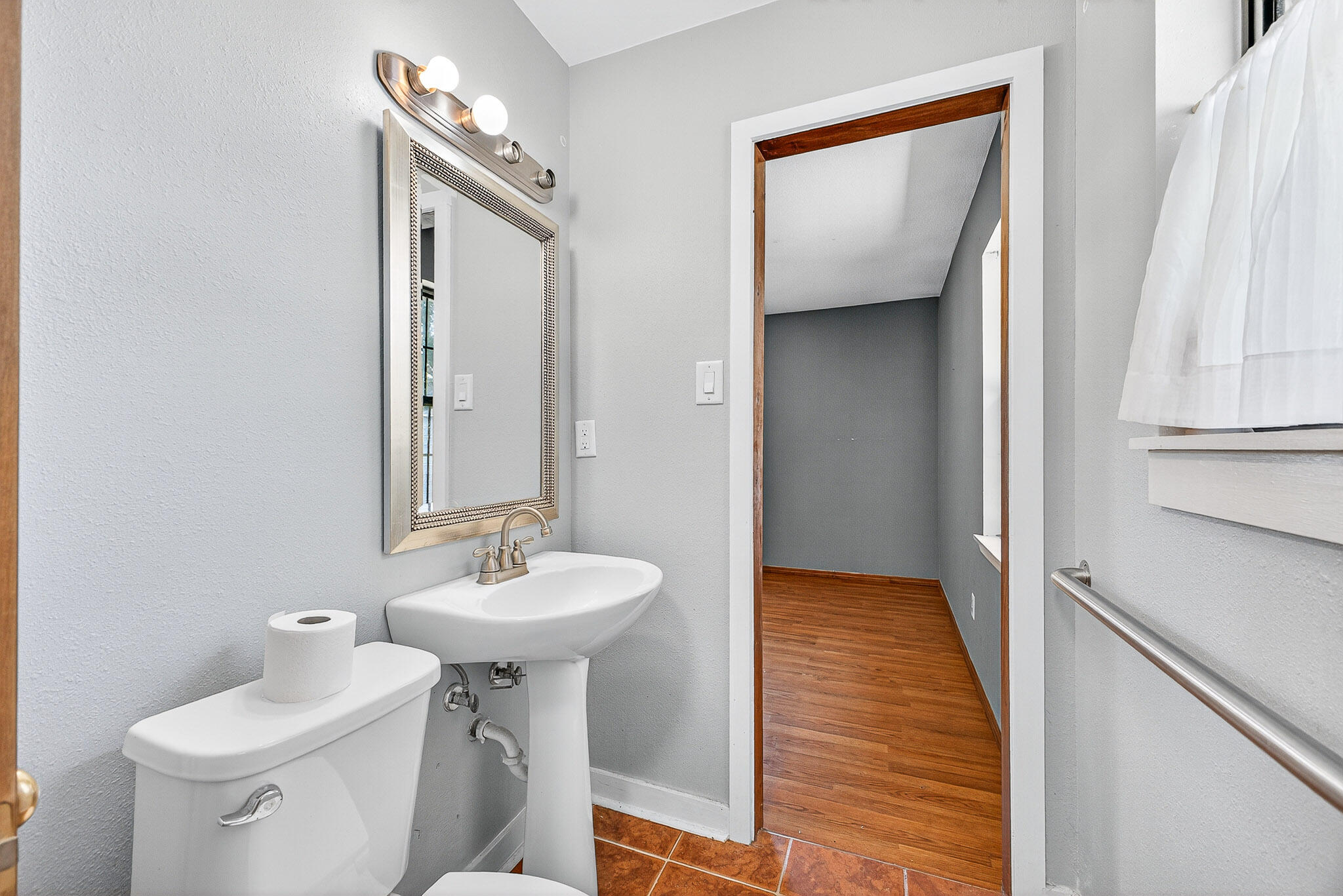 121 Boyce Road Shalimar, FL 32579 - Photo 25 of 34 a bathroom with a sink and a mirror