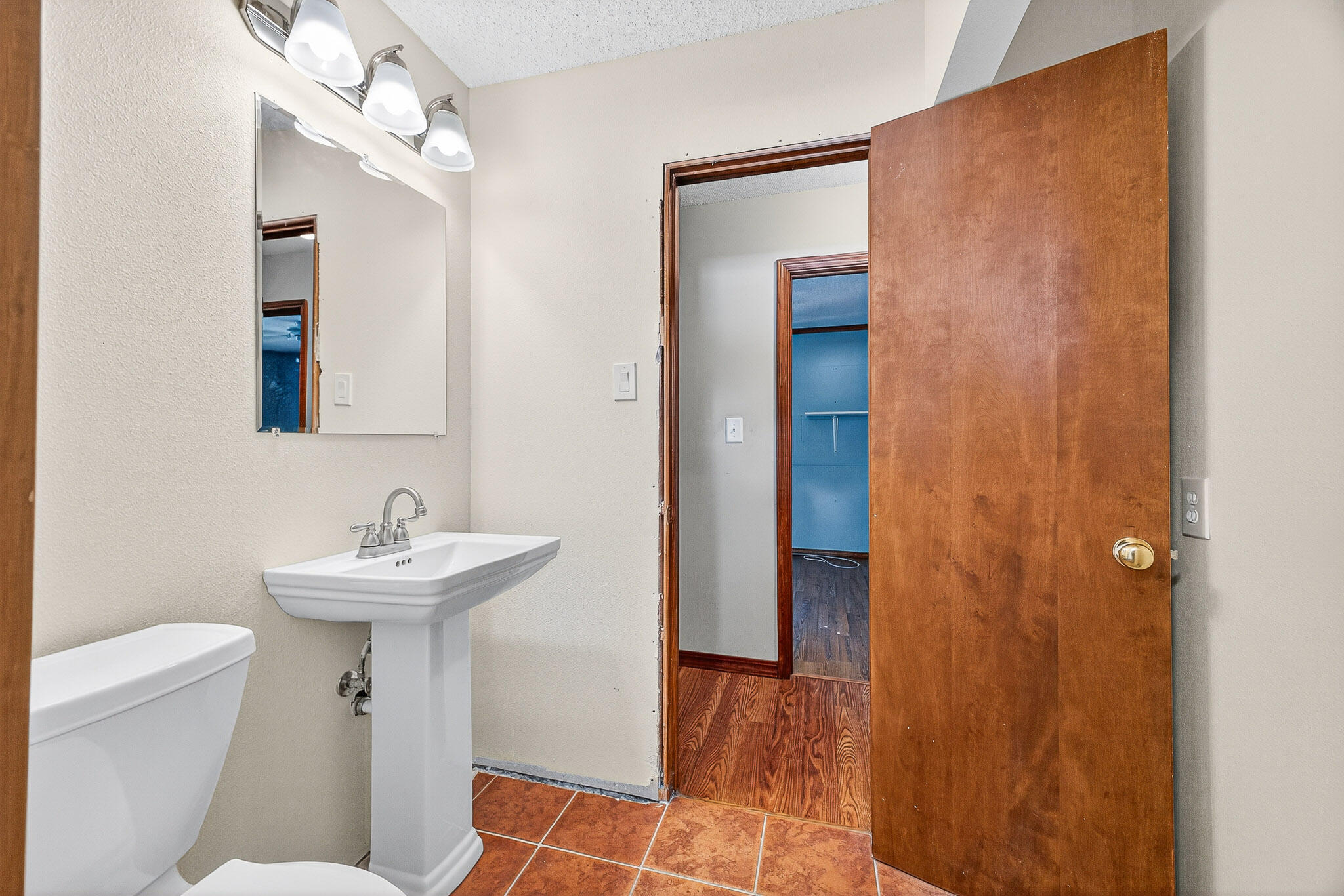 121 Boyce Road Shalimar, FL 32579 - Photo 26 of 34 a bathroom with a sink toilet and a mirror