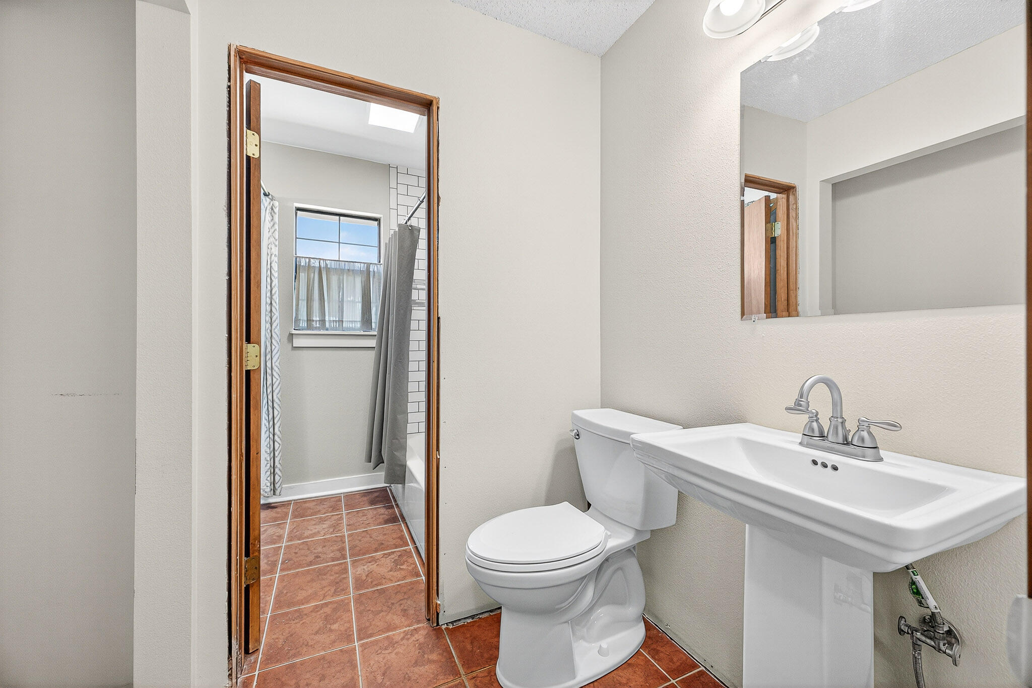 121 Boyce Road Shalimar, FL 32579 - Photo 27 of 34 a bathroom with a sink toilet and shower