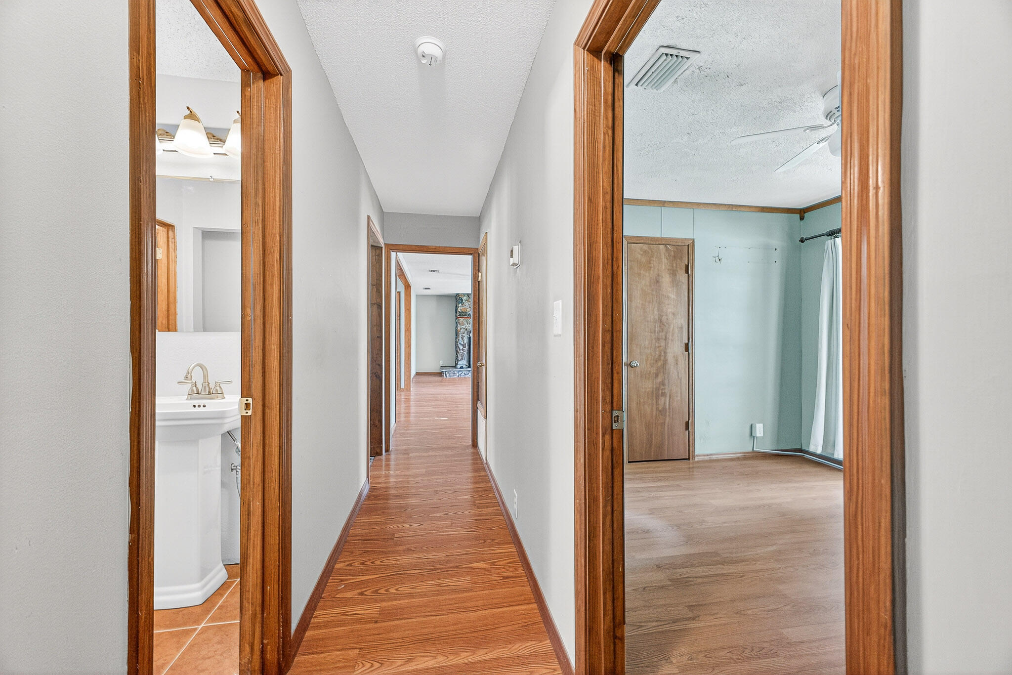 121 Boyce Road Shalimar, FL 32579 - Photo 28 of 34 a view of a hallway with wooden floor