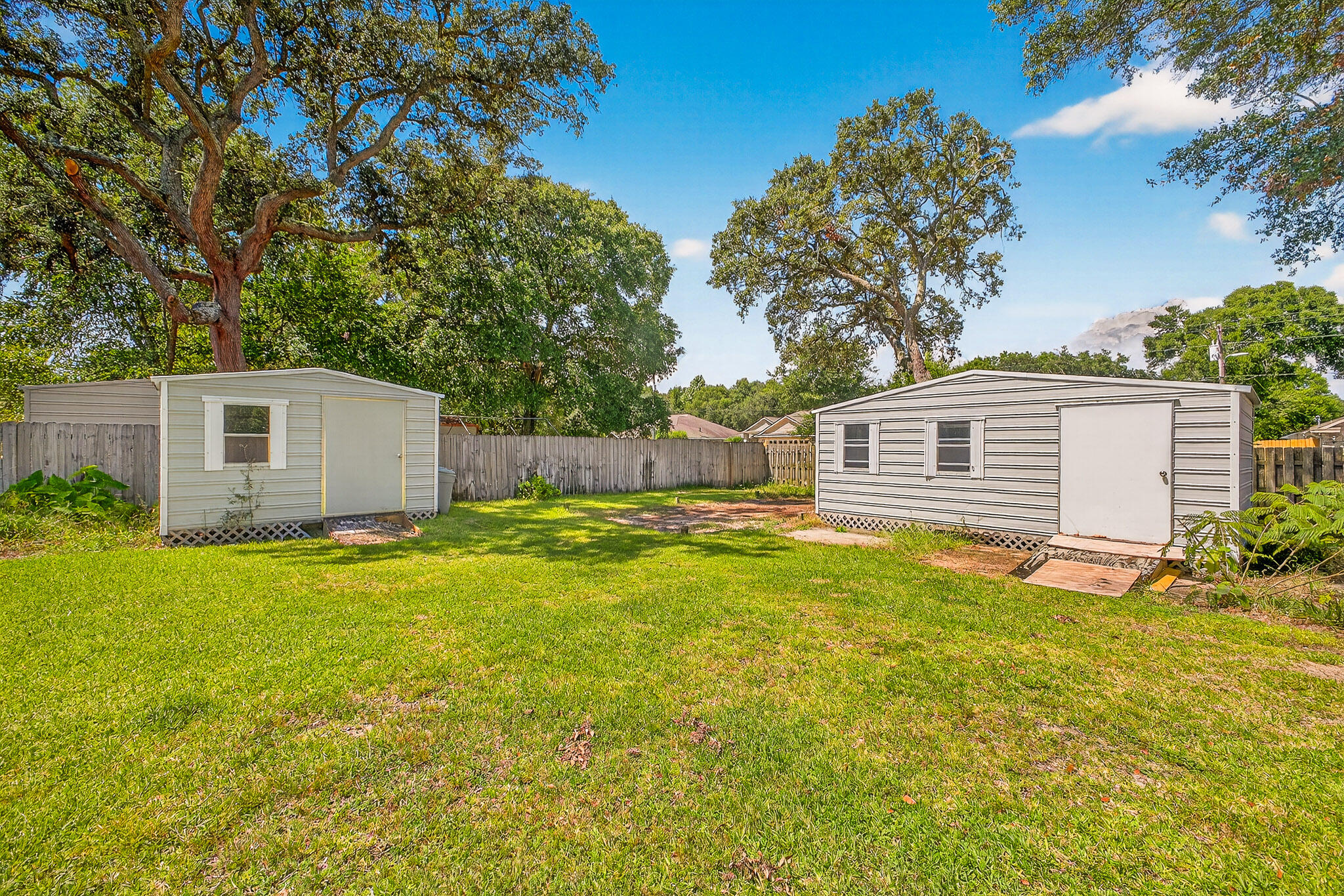 121 Boyce Road Shalimar, FL 32579 - Photo 32 of 34 a front view of house with yard and trees in the background