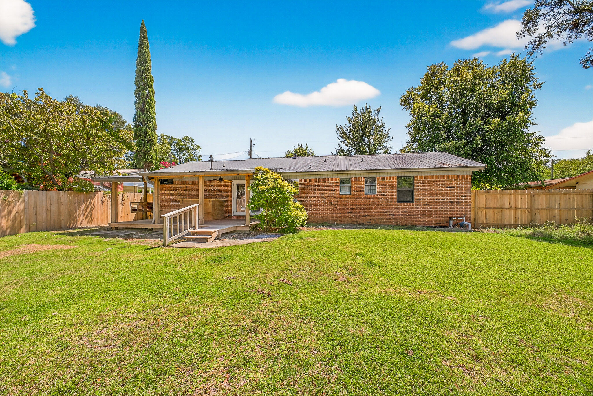 121 Boyce Road Shalimar, FL 32579 - Photo 33 of 34 a view of a house with backyard and a tree