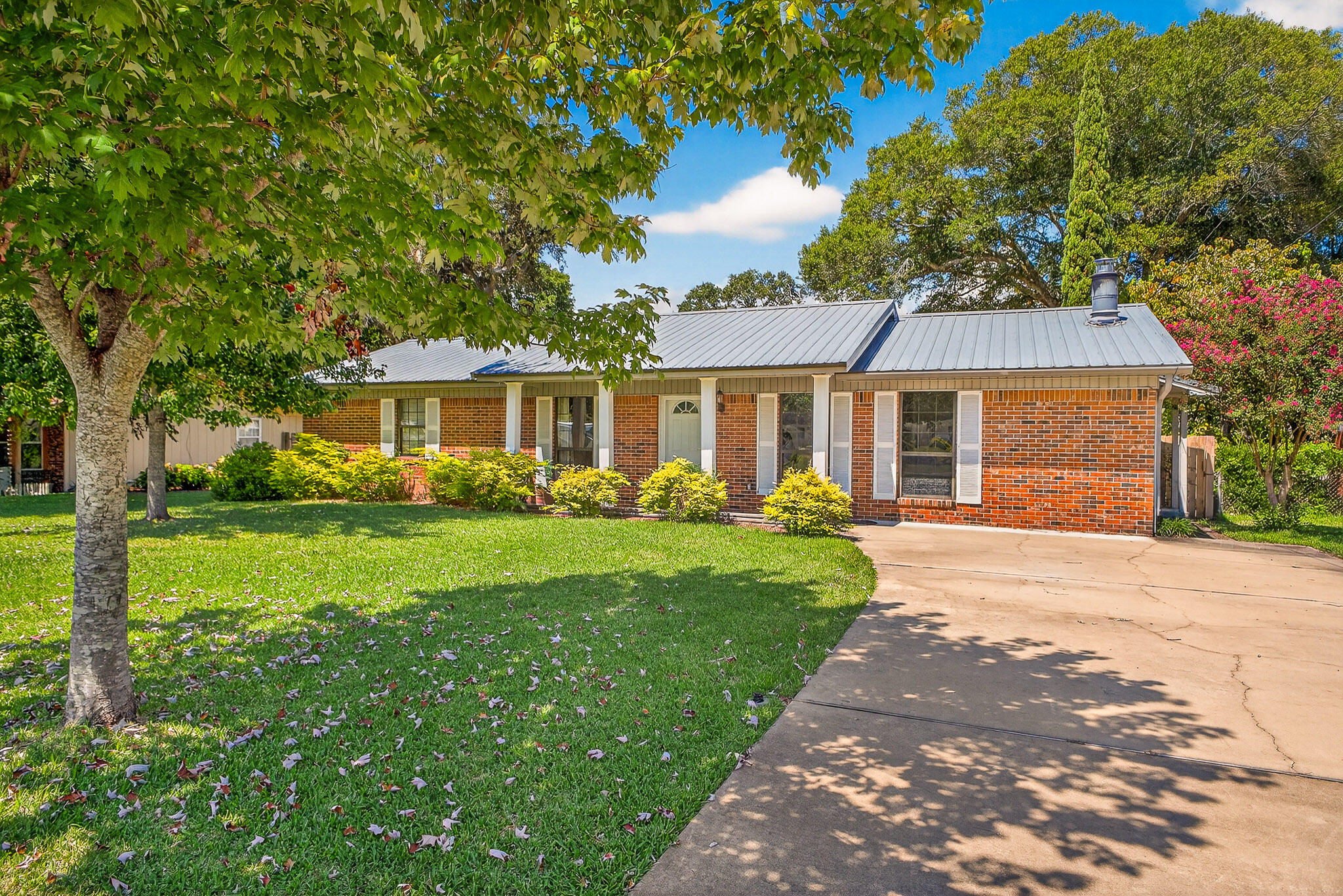 121 Boyce Road Shalimar, FL 32579 - Photo 34 of 34 a front view of a house with a yard and trees