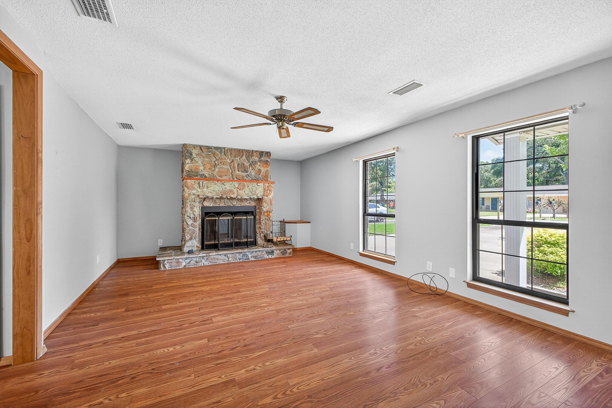 121 Boyce Road Shalimar, FL 32579 - Photo 4 of 34 a view of an empty room with a window and wooden floor