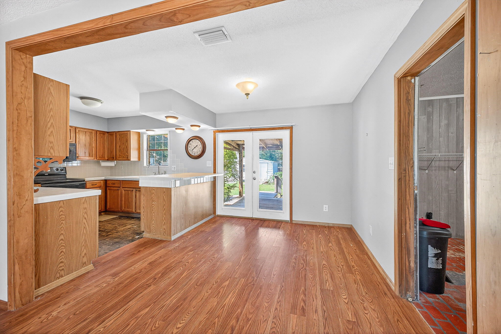 121 Boyce Road Shalimar, FL 32579 - Photo 6 of 34 a kitchen with stainless steel appliances granite countertop a lot of counter space and wooden floors