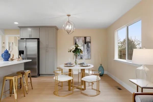 a view of a dining room with furniture window and outside view