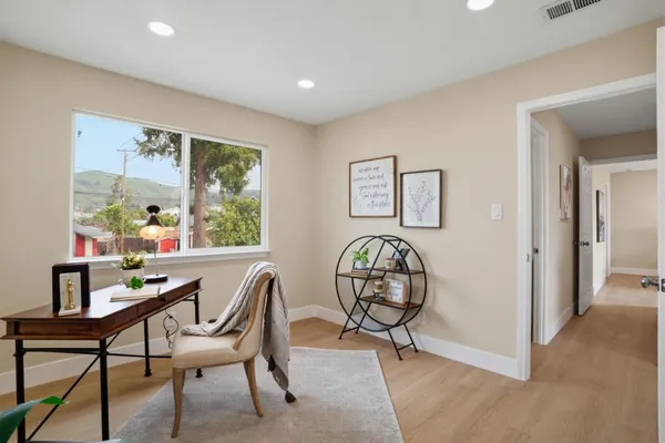 a dining room with furniture and window