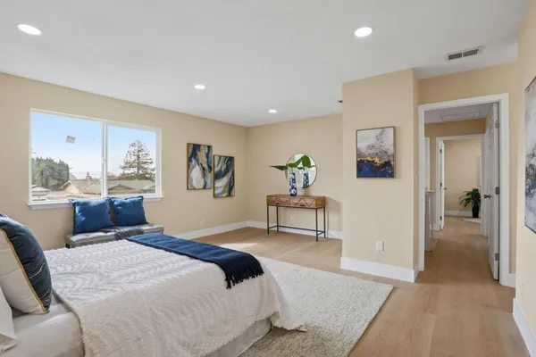 a bedroom with a bed and a table