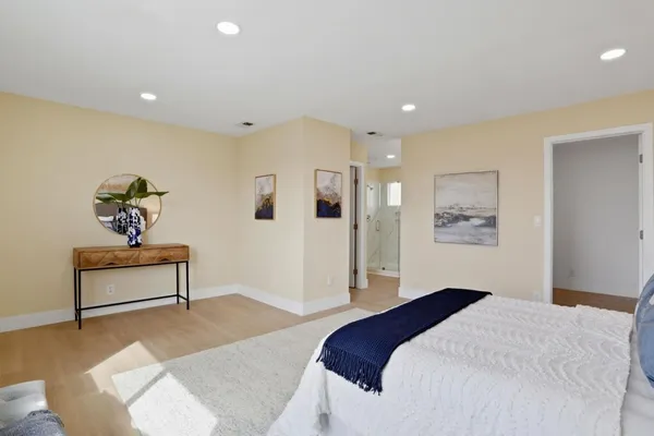 a bedroom with a bed and a table