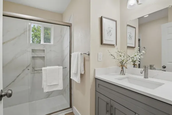 a bathroom with a sink and a mirror