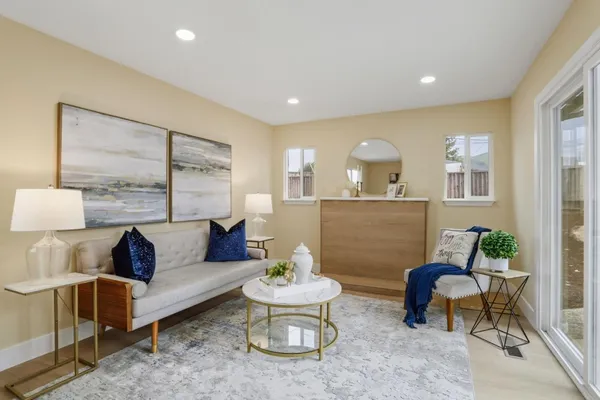 a living room with furniture and a large window