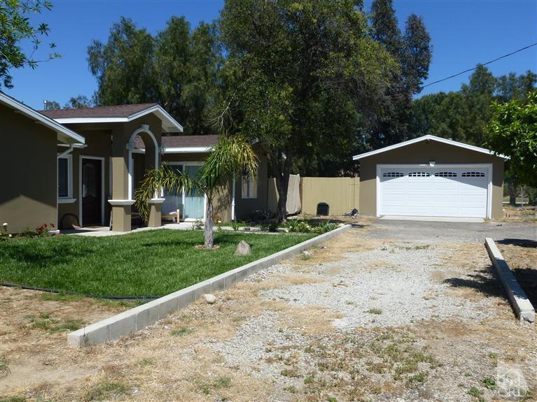 4591 Apricot Road Simi Valley, CA 93063 - Photo 3 of 15 a front view of a house with a yard