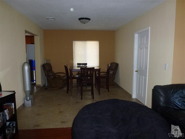 4591 Apricot Road Simi Valley, CA 93063 - Photo 10 of 15 a living room with furniture and a large window