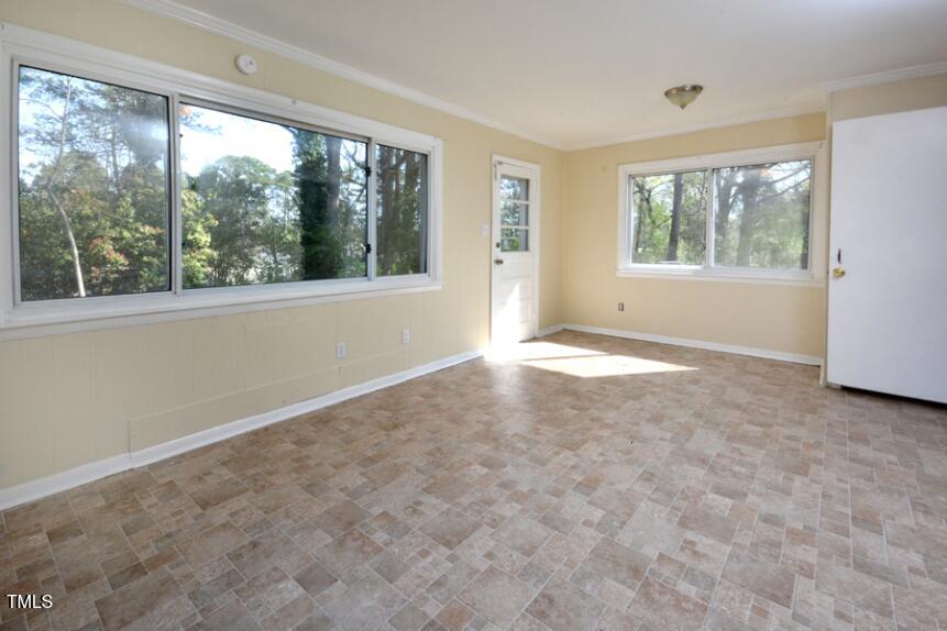 1817 Hillcrest Drive Durham, NC 27705 - Photo 23 of 29 a view of a big room with windows and front door