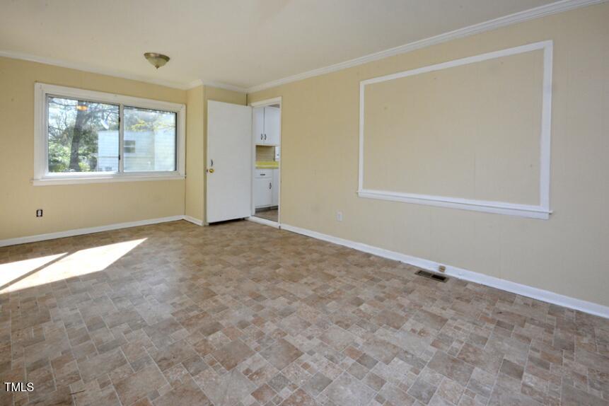 1817 Hillcrest Drive Durham, NC 27705 - Photo 24 of 29 an empty room with windows