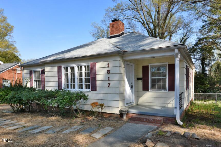 1817 Hillcrest Drive Durham, NC 27705 - Photo 3 of 29 a front view of a house with garden