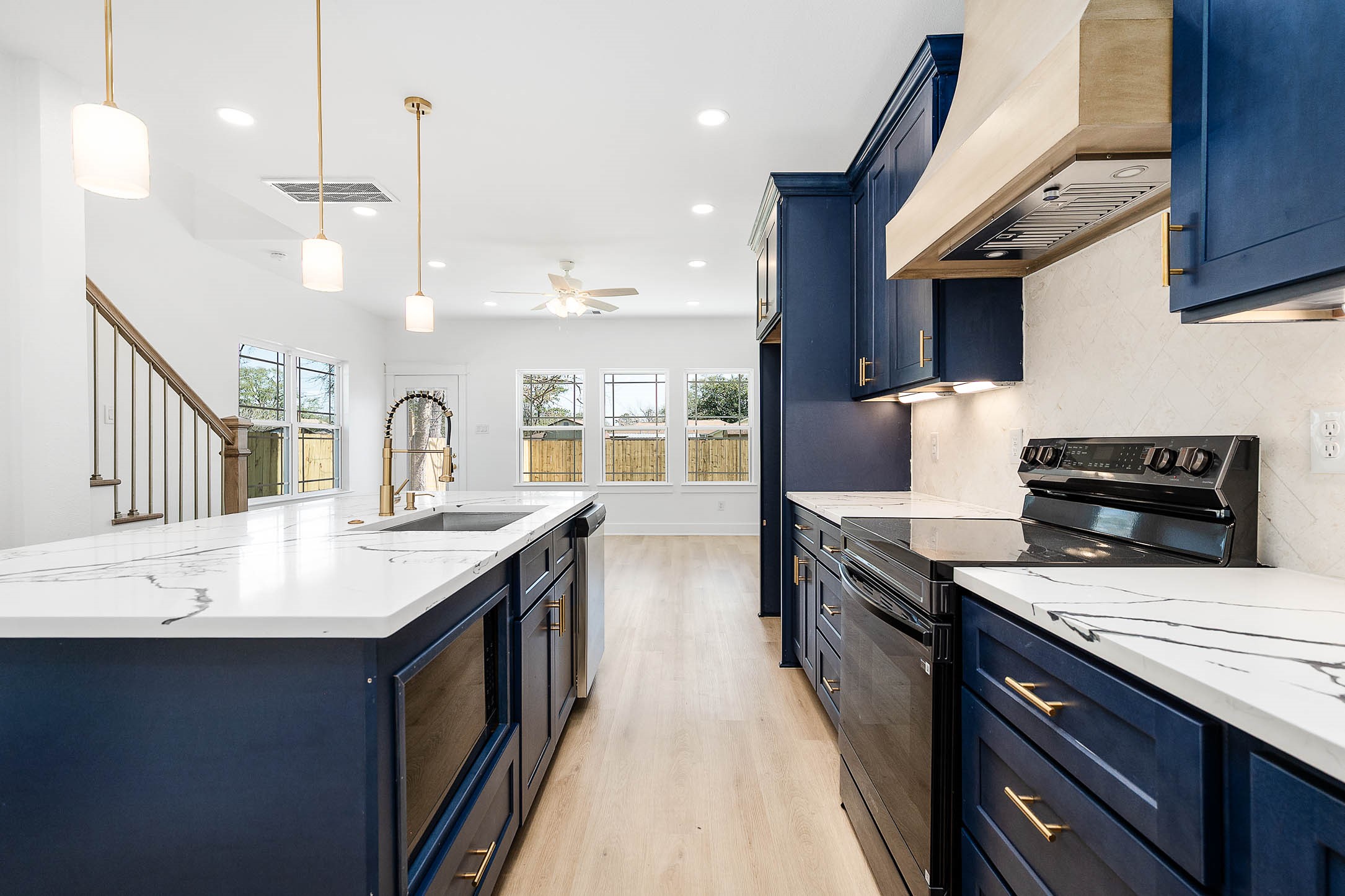 8602 Hoffman Street Houston, TX 77016 - Photo 9 of 30 Another angle showcasing the kitchen’s bright, open layout and seamless flow into the living area.