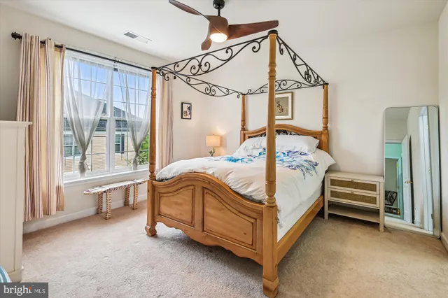 a bedroom with a bed and a flat screen tv in it