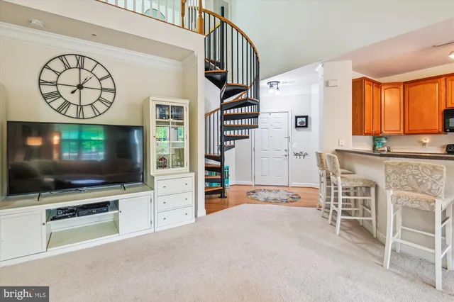 a view of a livingroom with furniture and a flat screen tv