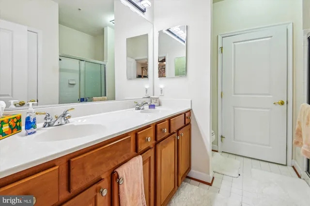 a view of walk in closet with clothes