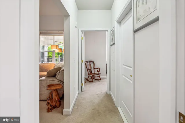 a view of a bedroom with wooden floor